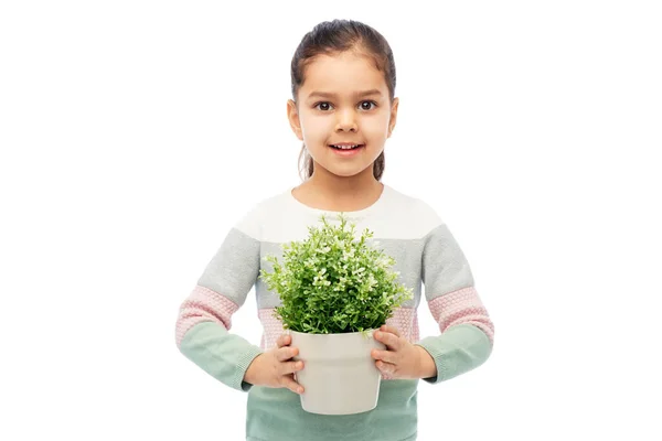 Glad leende flicka håller blomma i potten — Stockfoto