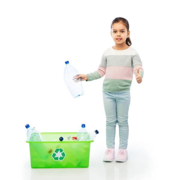 Girl sorting plastic waste and showing thumbs up — Stock Photo, Image