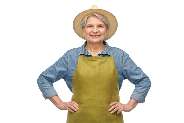 Portré mosolygós idős nő kerti kötény — Stock Fotó