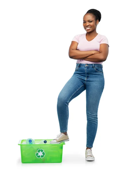 Smiling young asian woman sorting plastic waste — Stock Photo, Image