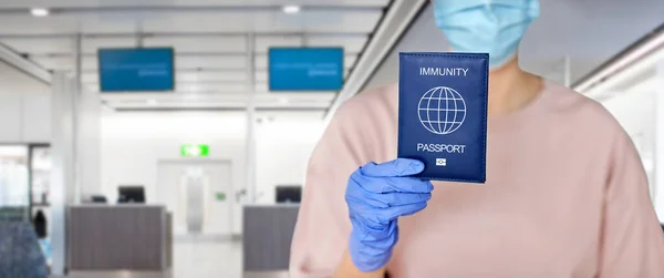 Close up of woman holding immunity passport — Stock Photo, Image