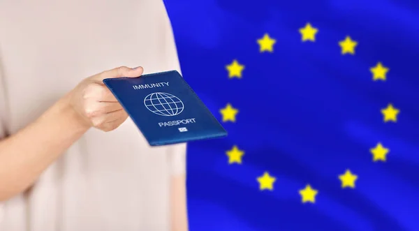 Close up of woman holding immunity passport — Stock Photo, Image