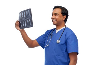 happy indian doctor or male nurse with x-ray clipart