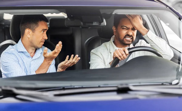 car driving instructor talking to man failed exam