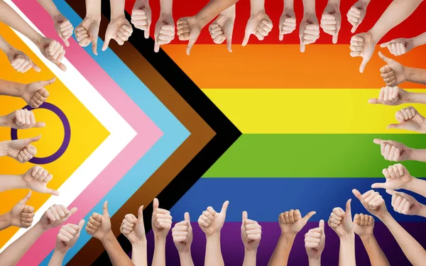 Hands showing thumbs up over progress pride flag — Stock Photo, Image