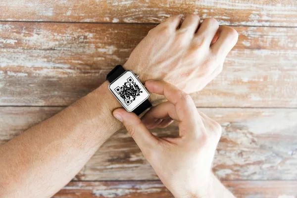 Male hands with qr code on smart watch — Stock Photo, Image