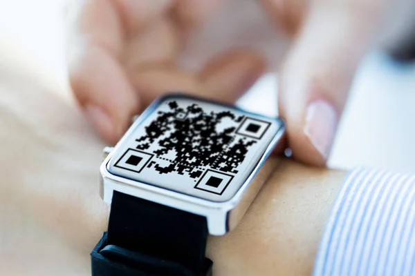 Womans hands with qr code on smart watch — Stock Photo, Image