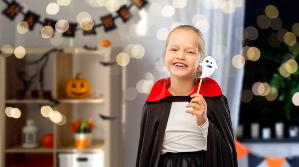 Girl in costume of dracula with cape on halloween — Stock Photo, Image