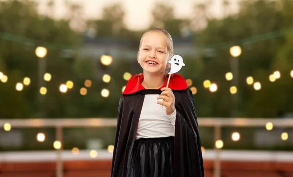 Girl in costume of dracula with cape on halloween — Stock Photo, Image