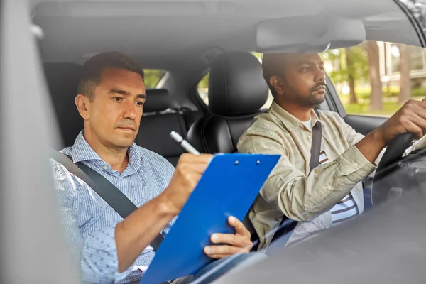 car driving school instructor and young driver