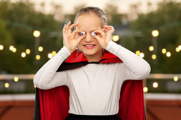 Girl in halloween costume of dracula with eyeballs — Stock Photo, Image