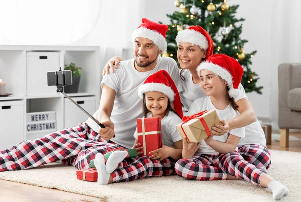 Happy family taking selfie on christmas at home — Stock Photo, Image