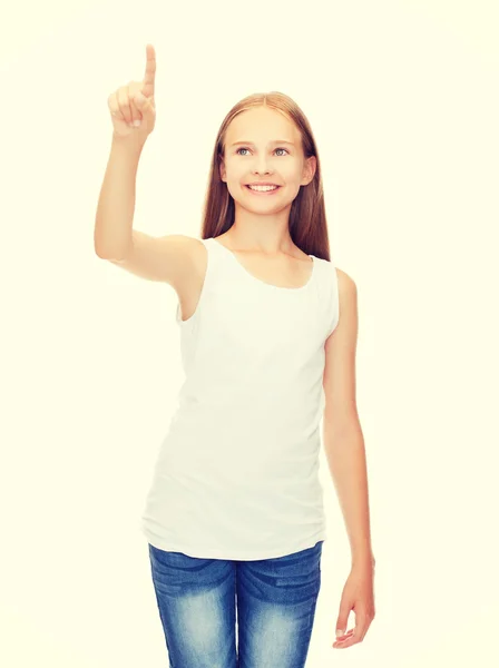 Chica con camisa blanca en blanco apuntando a algo —  Fotos de Stock