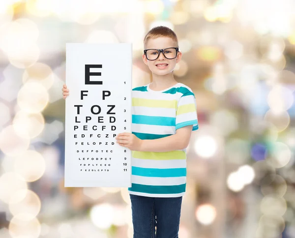 Smiling boy in eyeglasses with white blank board — Stock Photo, Image