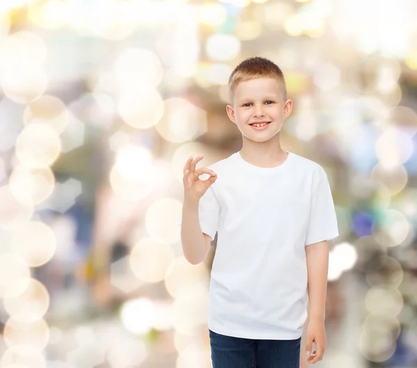 Smiling little boy in white blank t-shirt — Stock Photo, Image