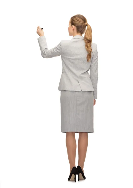 Businesswoman or teacher with marker from back — Stock Photo, Image