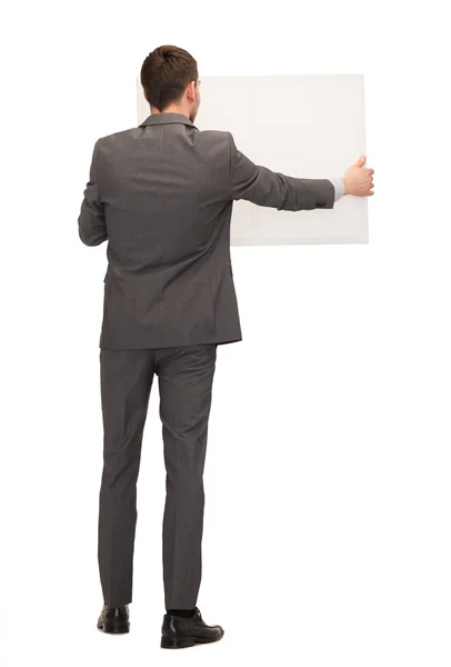 Бизнесмен или учитель с белой доской сзади — стоковое фото