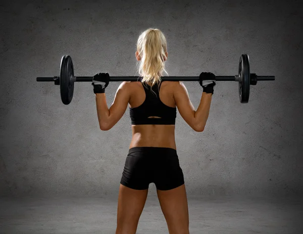 Mujer deportiva haciendo ejercicio con la barra de la espalda —  Fotos de Stock