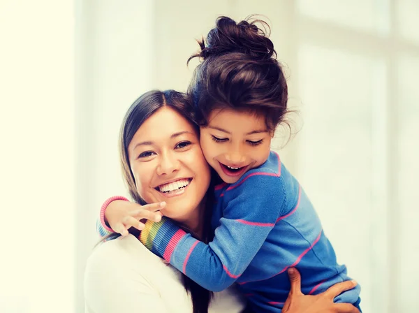 Hugging mother and daughter — Stock Photo, Image