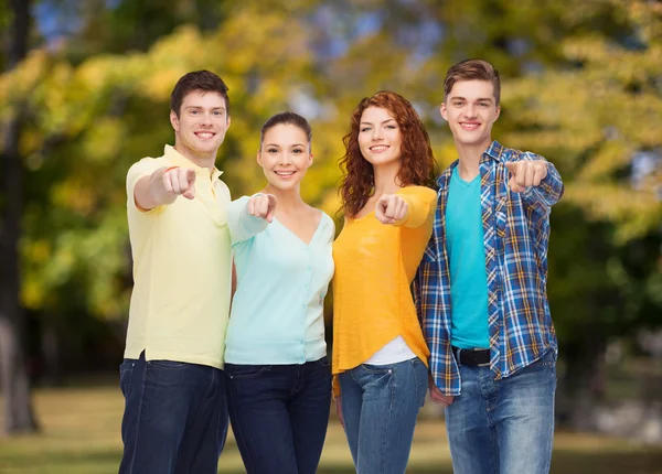 Group of smiling teenagers pointing fingers on you — Stock Photo, Image