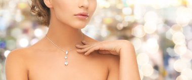 woman wearing shiny diamond pendant clipart