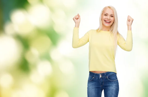 Laughing young woman with hands up — Stock Photo, Image