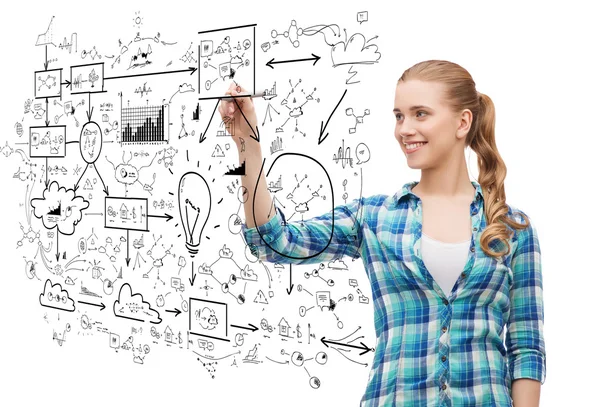 Smiling young woman writing on virtual screen — Stock Photo, Image