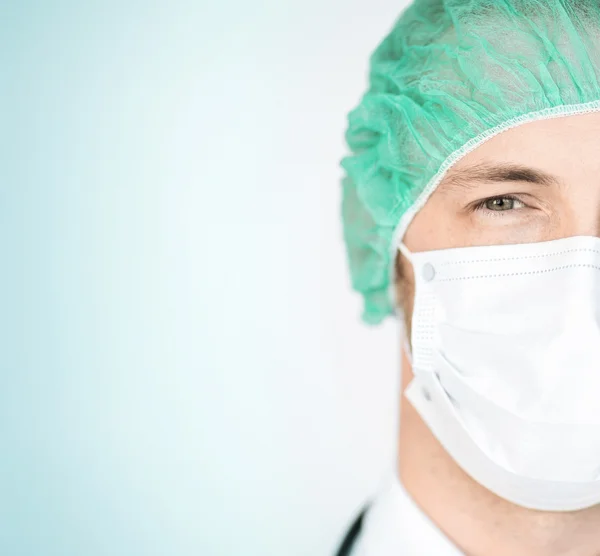 Surgeon in medical cap and mask — Stock Photo, Image