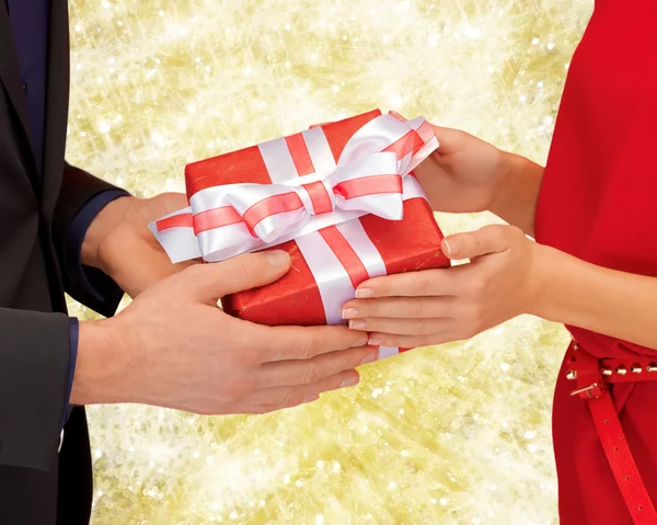 Close up of man and woman with present — Stock Photo, Image