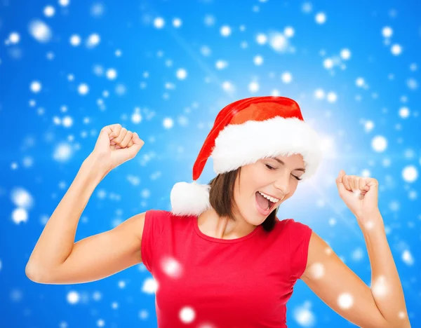 Mujer sonriente en sombrero de ayudante de santa —  Fotos de Stock