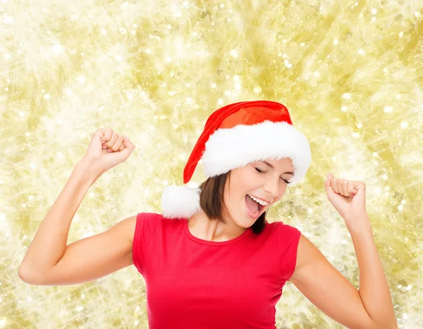 Mujer sonriente en sombrero de ayudante de santa —  Fotos de Stock