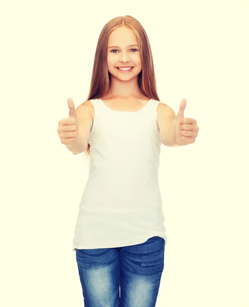 Dívka v prázdné bílé tričko ukazuje palec — Stock fotografie