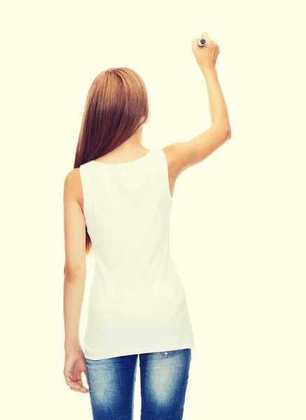 Girl in blank white shirt drawing something — Stock Photo, Image