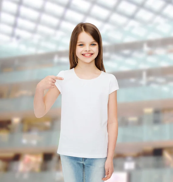 Smiling little girl in white blank t-shirt — Stock Photo, Image