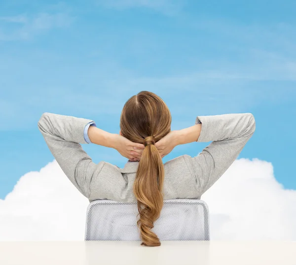 Business woman sitting on chair from back — стоковое фото