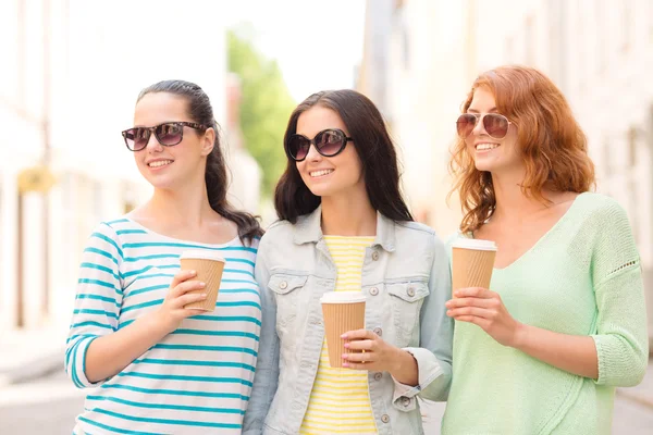 Smiling teenage girls with on street — Stock Photo, Image