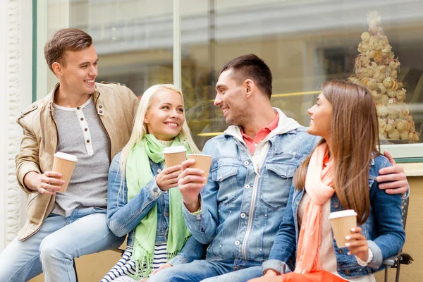 Group of smiling friends with take away coffee — Stock Photo, Image