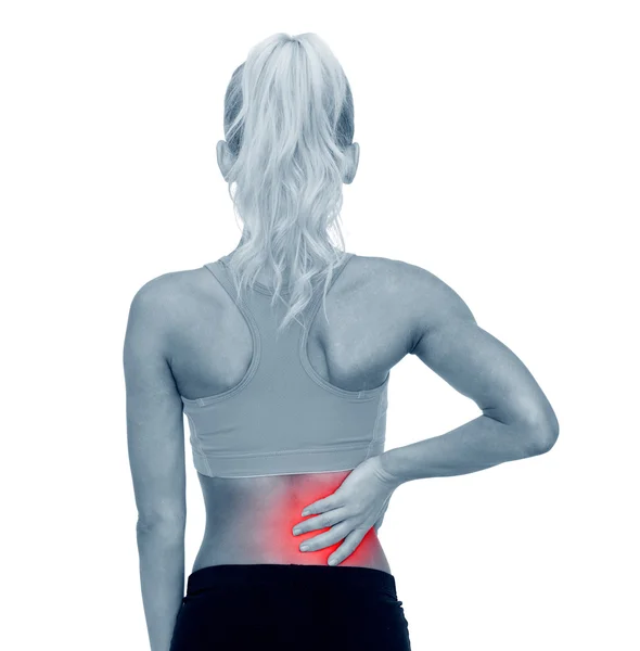 Sporty woman touching her back — Stock Photo, Image