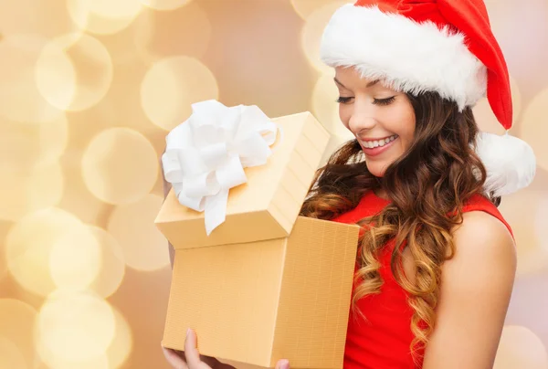 Smiling woman in red dress with gift box — Stock Photo, Image