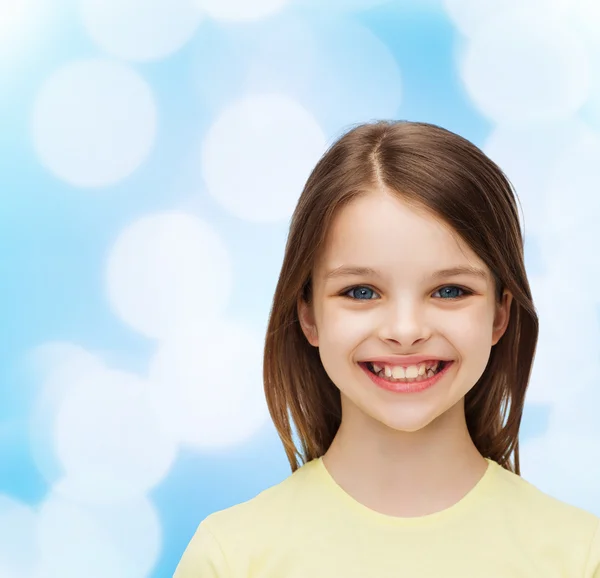 Smiling little girl over white background — Stock Photo, Image