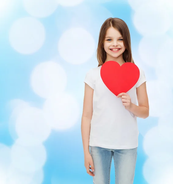 Beautiful little girl sitting at table — Stock Photo, Image