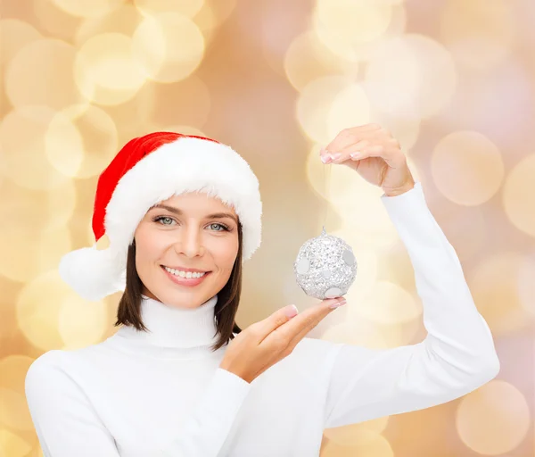 Woman in santa helper hat with christmas ball — Stock Photo, Image