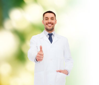 smiling male doctor showing thumbs up clipart