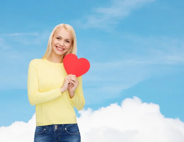 Smiling woman with red heart — Stock Photo, Image