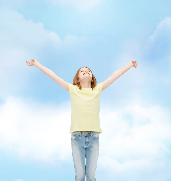 Smiling teenage girl with raised hands — Stock Photo, Image