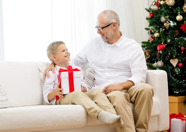 Smiling grandfather and grandson at home — Stock Photo, Image