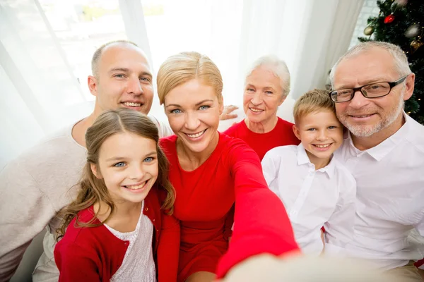 Smiling family making selfie at home — Stock Photo, Image