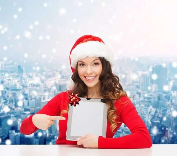 微笑的圣诞老人与礼物和 tablet pc 的帽子的女士 — 图库照片