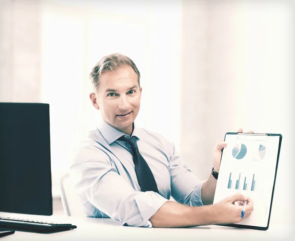 Businessman showing graphs and charts — Stock Photo, Image