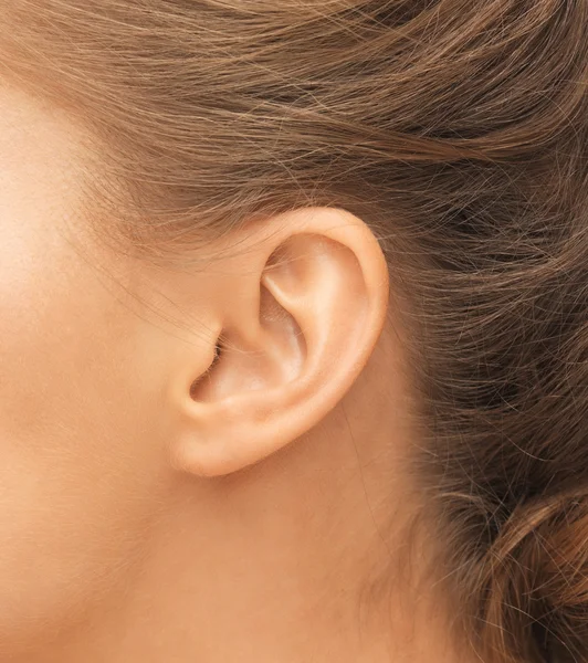Close up of womans ear — Stock Photo, Image